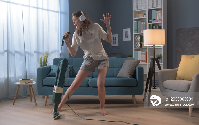 Woman cleaning up her house and singing