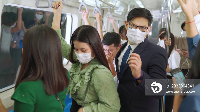 Sick man on train cough and make other people feel worry about virus spreading . Coronavirus COVID 19 pandemic and public transportation trouble concept .