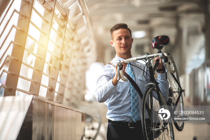 Smart Businessman Holding Bicycle goto Work on Urban Sidewalk in Rush Hour  - Eco Friendly and Lifestyles Concept