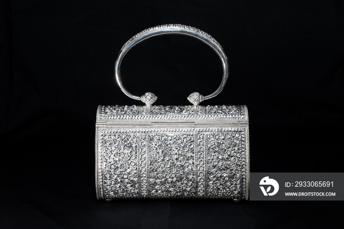 Luxury silver handbag on black background, Beautiful silver purse isolated on black background