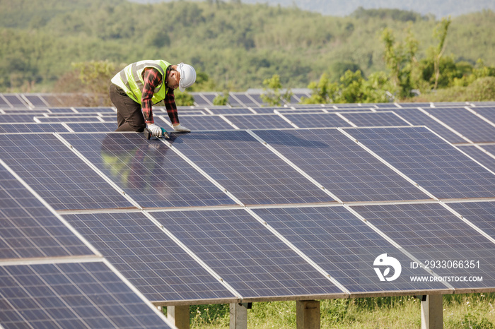 worker installing the solar panels.Solar power energy. renewable energy, Solar power plant. worker maintenance of solar power plants who perform inspections and maintenance of solar power plants.