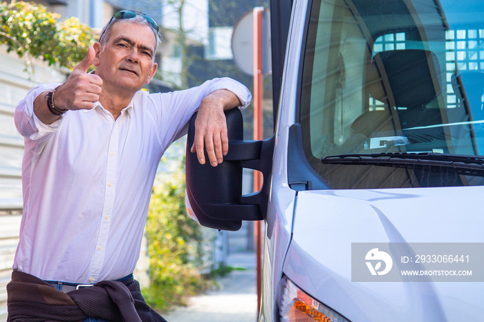 trucker or carrier with his van ready for delivery