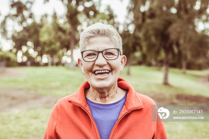 Old woman smiling in camera - Joyful elderly concept