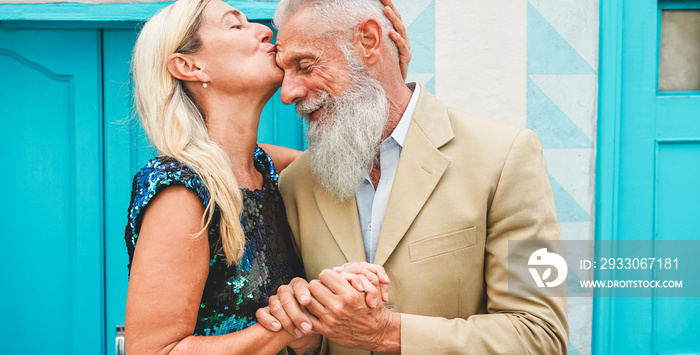 Happy senior couple having tender moments outdoor - Mature people enjoying time together - Love, fashion and joyful elderly active lifestyle concept - Focus on faces