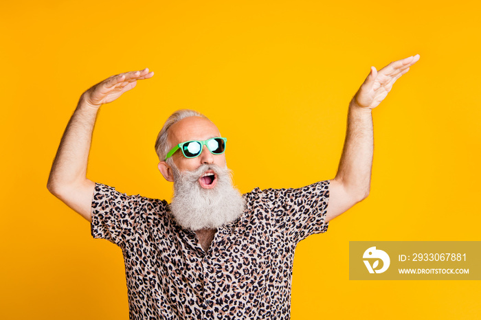 Photo of dancing cheerful rejoicing cool old man feeling young dancing in front of yellow vivid background he is isolated over