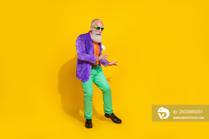 Full body photo of attractive granddad cool hipster dance retro party dressed stylish colorful outfit isolated on yellow color background