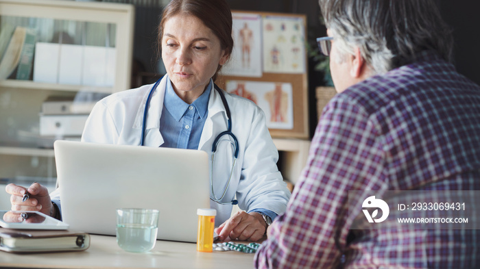 Doctor with patient in medical office