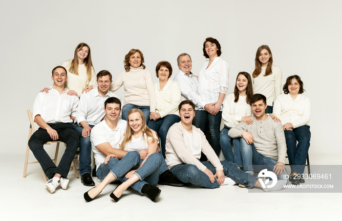 cheerful family on a white background. people of different ages and nationalities. family members. group portrait on white background