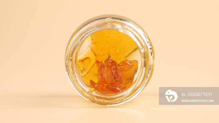 cannabis extract rosin with high thc in a glass bottle.