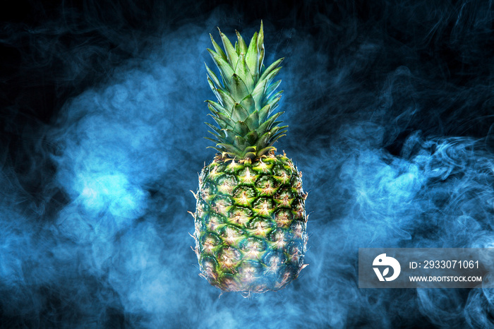 Pineapple fruit on background with vape smoke