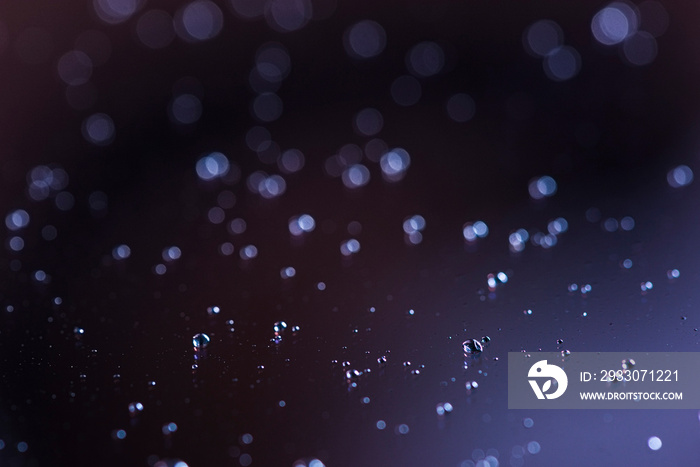 Closeup of a tablet screen with droplets on its surface after sneezing in the age of Coronavirus