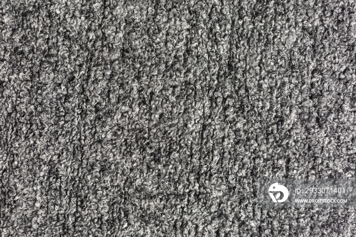 knitted boucle fabric background in grey