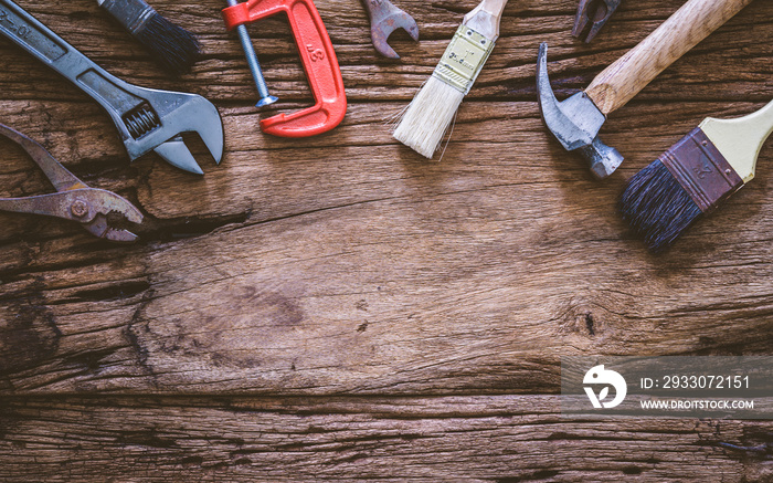 Set of rusty hand tools renovation on grunge wood. copyspace image. construction instrument background with blank space concept.