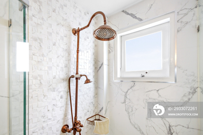 Close-Up vintage shower and window in bathroom , on white marble wall backgrounds