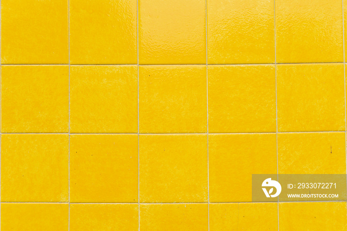 Detail of a wall of yellow tiles