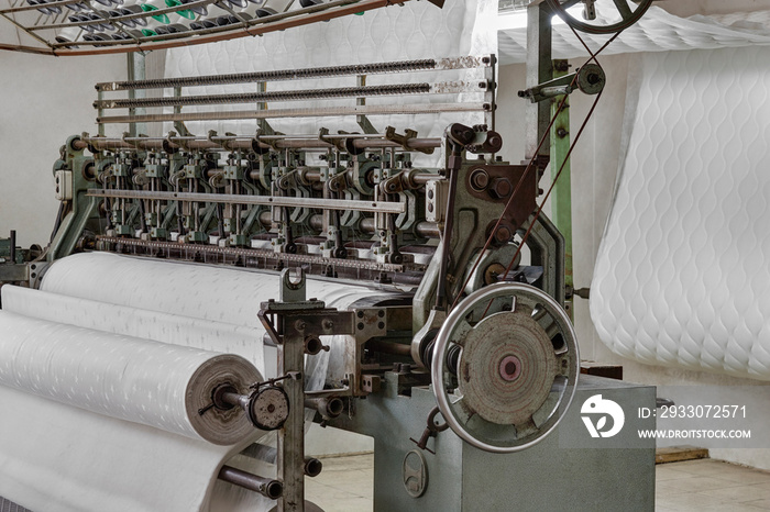 Quilting machine, mattress production in the factory.