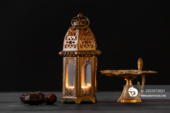 Muslim lamp and dates on dark background