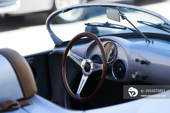 Vintage retro car interior, close-up. Old automobile steering wheel