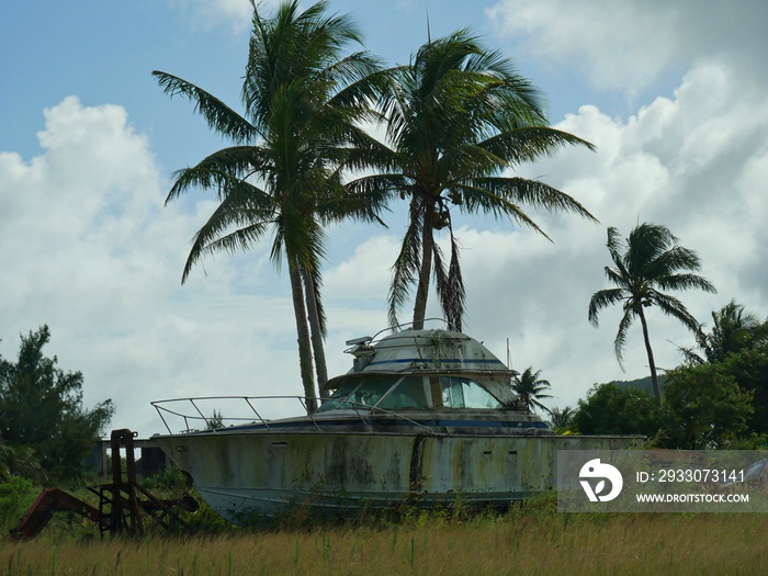 Abandoned boat in the farm, Rota An abandoned boat collects rust and moss in a farm in the island of Rota, Northern Mariana Islands.