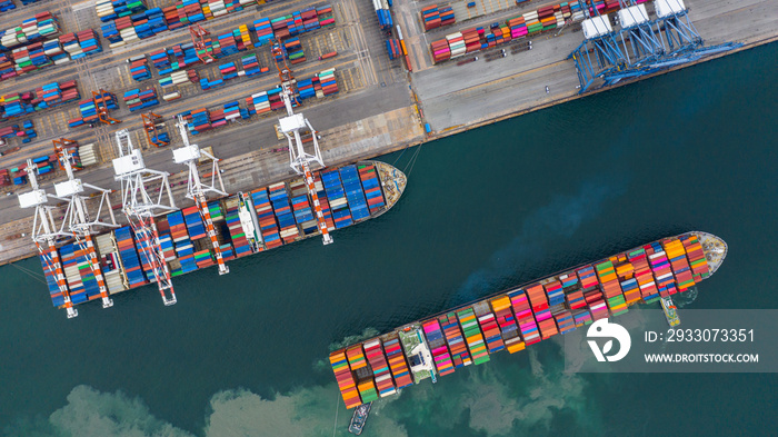 Aerial view cargo ship terminal, Unloading crane of cargo ship terminal, Aerial view industrial port with containers and container ship.