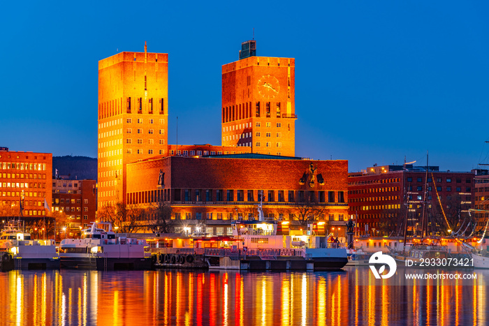 Night view of town hall in oslo viewed behind the port, Norway