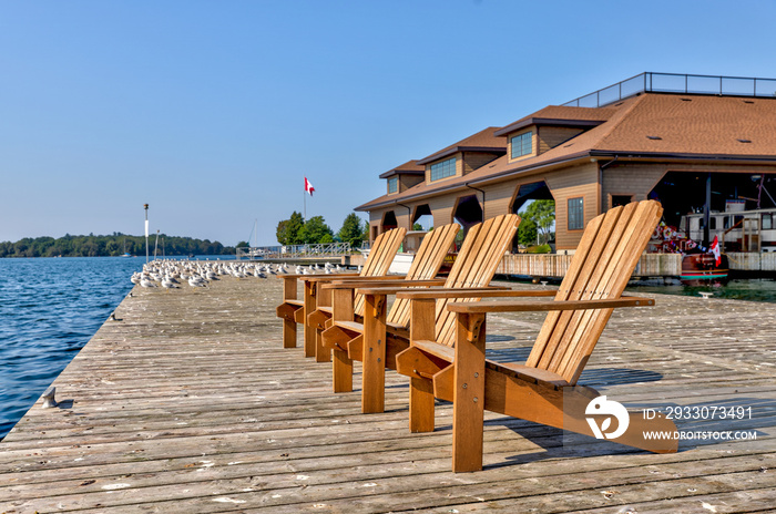 Adirondack chairs on a dock in Gananoque on the St Lawrence River