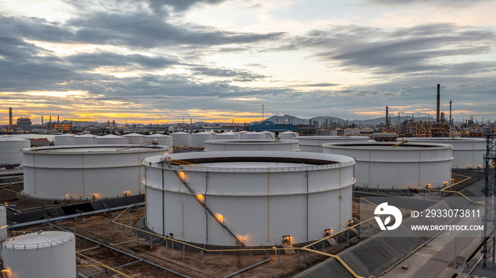 Crude oil storage tank terminal port, Oil terminal pipeline fuel storage tank at oil refinery industrial zone in the cargo seaport and ship tanker and storage silo tank at petrochemical terminal port.