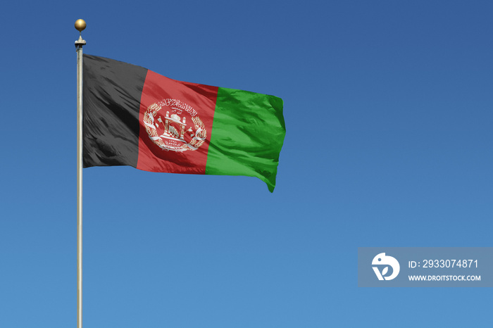 Flag of Afghanistan on a clear blue sky