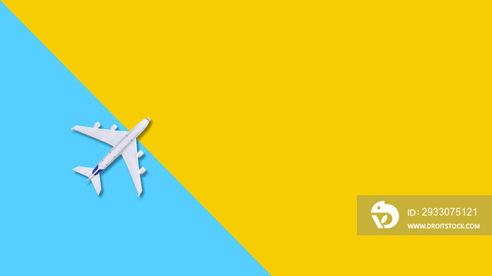 plane on a yellow  background. travel background for travel agency banner,poster. Flat  lay with  copy space