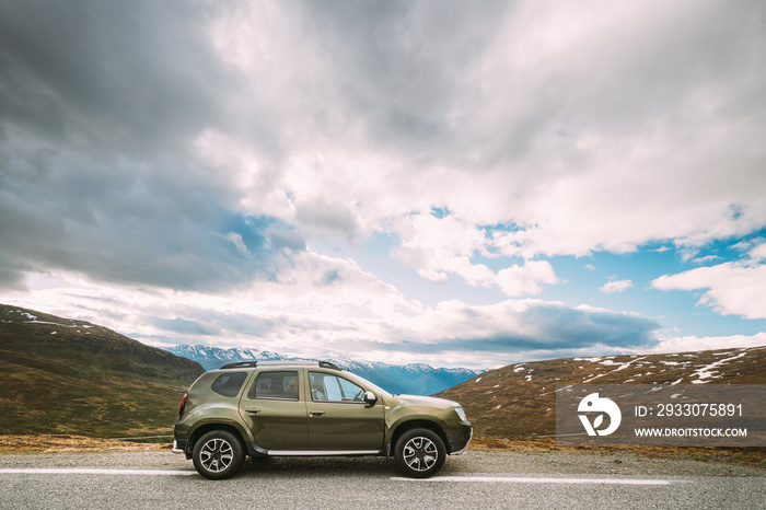 Aurlandsfjellet, Norway. Car SUV Parked Near Aurlandsfjellet Scenic Route Road In Summer Norwegian Landscape. Natural Norwegian Landmark And Popular Destination