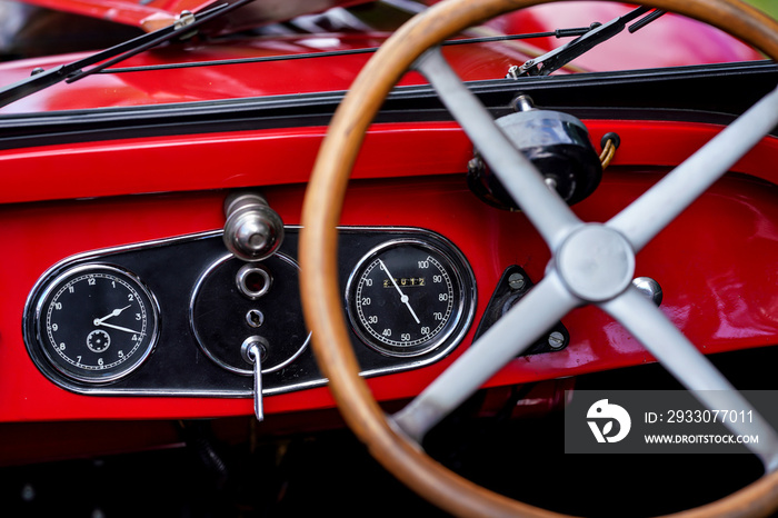 Speedometer on vintage red car, closeup detail