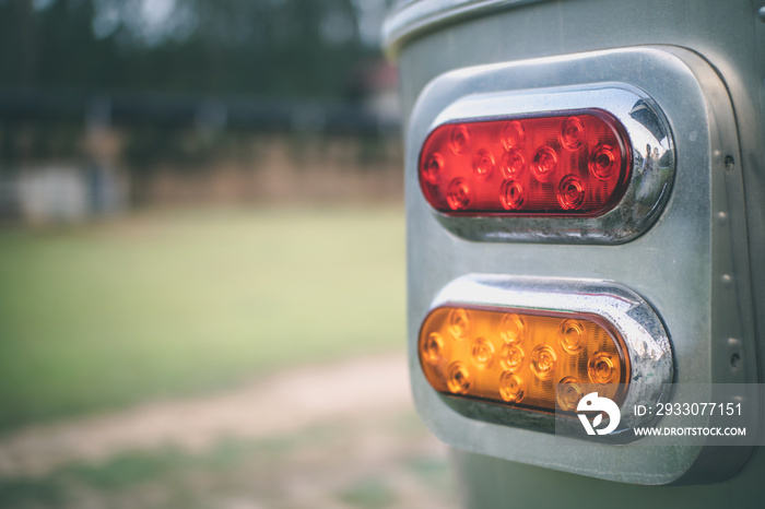 Close up red and yellow classic taillight of travel trailer.