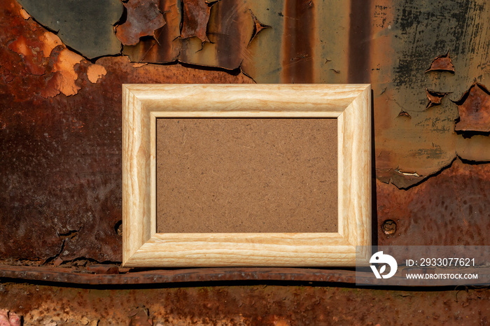 Empty Picture Frame on Vintage Rusty Metal Shelf