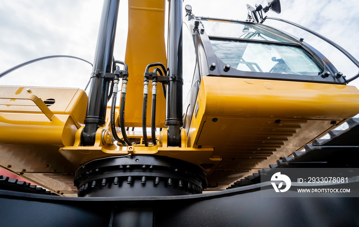 Details of hydraulicheavy duty equipment vehicle on display area of dealership