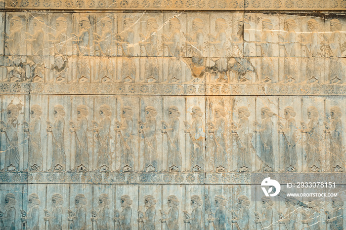 Ancien inscriptions on the walls of Persepolis, the ancient capital of old Persian Achaemenid Empire in Iran, Zoroastrian symbol Faravahar