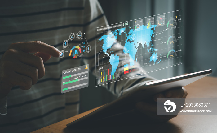 young entrepreneur using big data analysis and cloud technology to collect customer data and display on application dashboard from digital tablet to understand sale forecast and marketing plan.