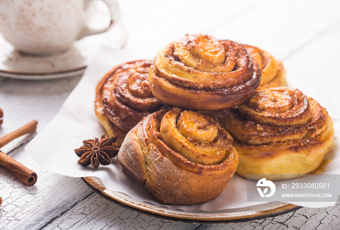 Latte or cacao and Cinnamon Bun for breakfast or break on white background. Cup of coffee and homemade buns