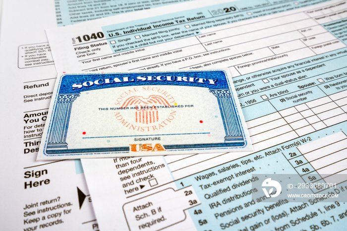 Blank social security card, and 1040 us individual tax income return form.