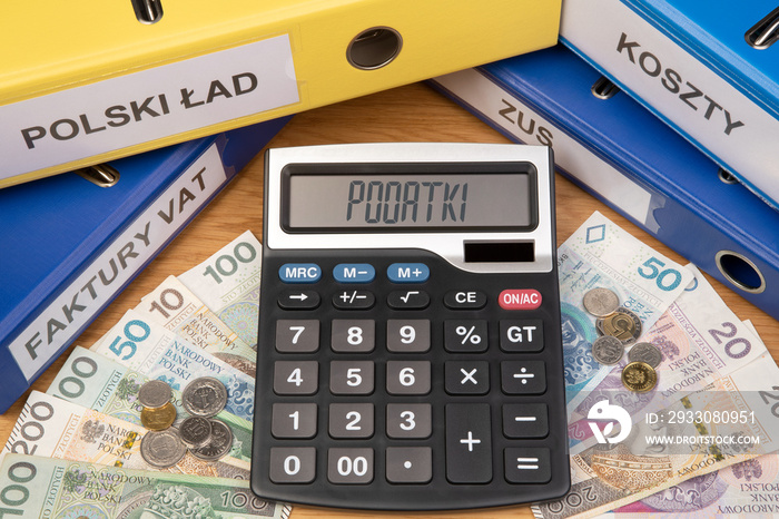 Taxes in Poland, text Podatki on a digital display on a calculator on an accountant desk