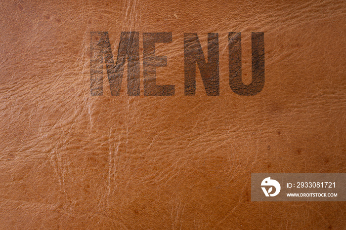 Menu written on brown textured leather