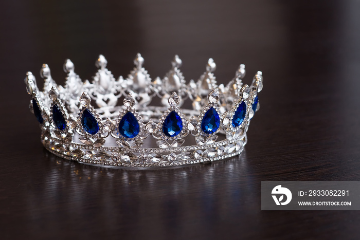 Royal crown with sapphires. Wealth symbol of power and success