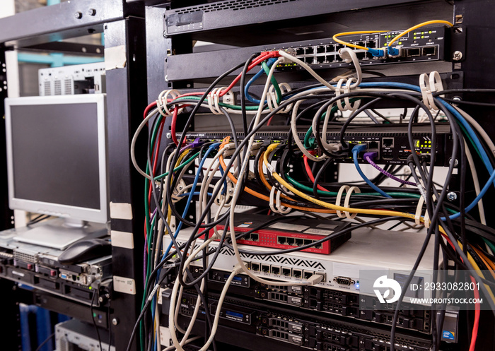 Server room with computers for internet. Network cables connected to switches.