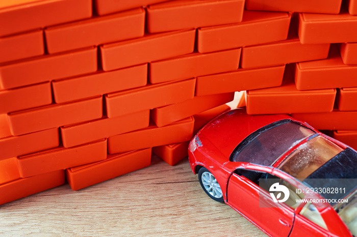 Car crash accident. Automobile hit a brick wall. A car insurance concept