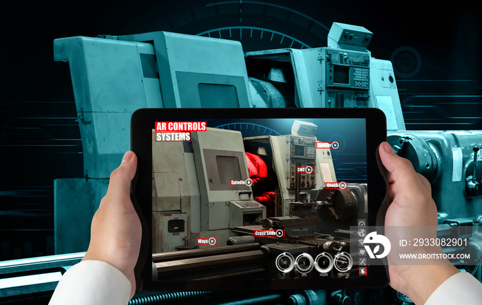 Engineer use augmented reality software in smart factory production line with automated application . Futuristic machinery in working in concept of Industry 4.0 or 4th industrial revolution.