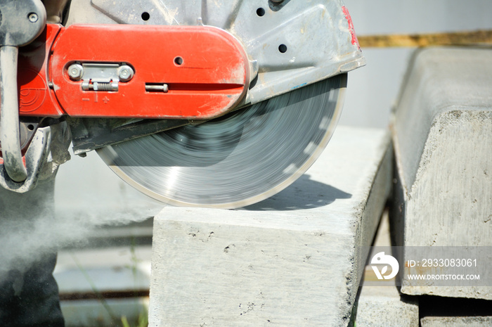 Fragment of a joint cutter on a brushed concrete surface.