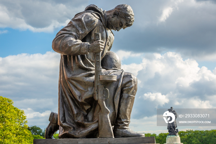 Red Army soldier on knees in Tretptower soviet war memorial, Berlin Germany