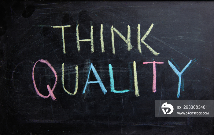 Concept always think of Quality. Handwriting text writing Think Quality on blackboard.