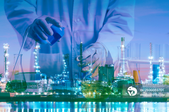 Petrochemical concept composite image of laboratory testing tube on the Oil&Gas refinery background showing the concept of high quality control of product