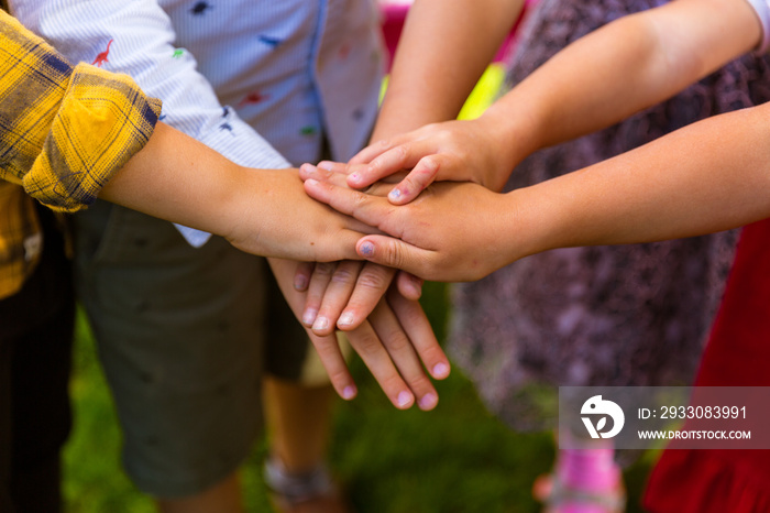 Kids joining hands together