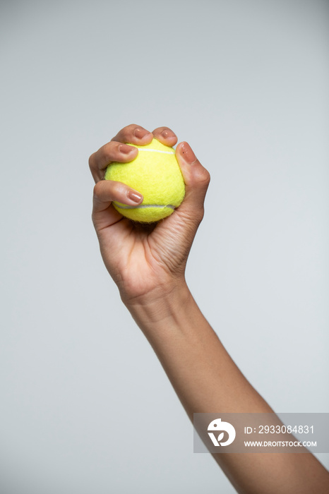 Woman holding tennis ball